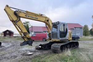 New Holland E135 SR metsäteloilla